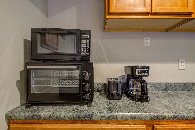 Oven, Microwave, toaster and coffee maker.