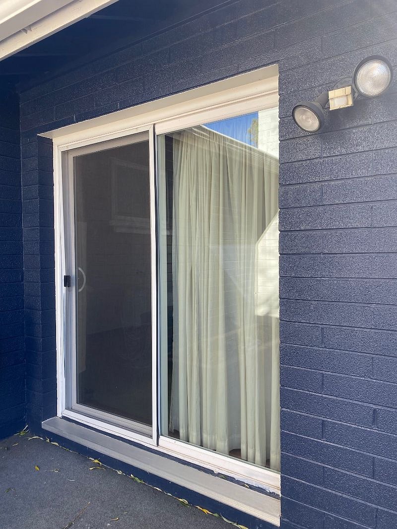 Locking Sliding glass door entry way accessed from the backyard.