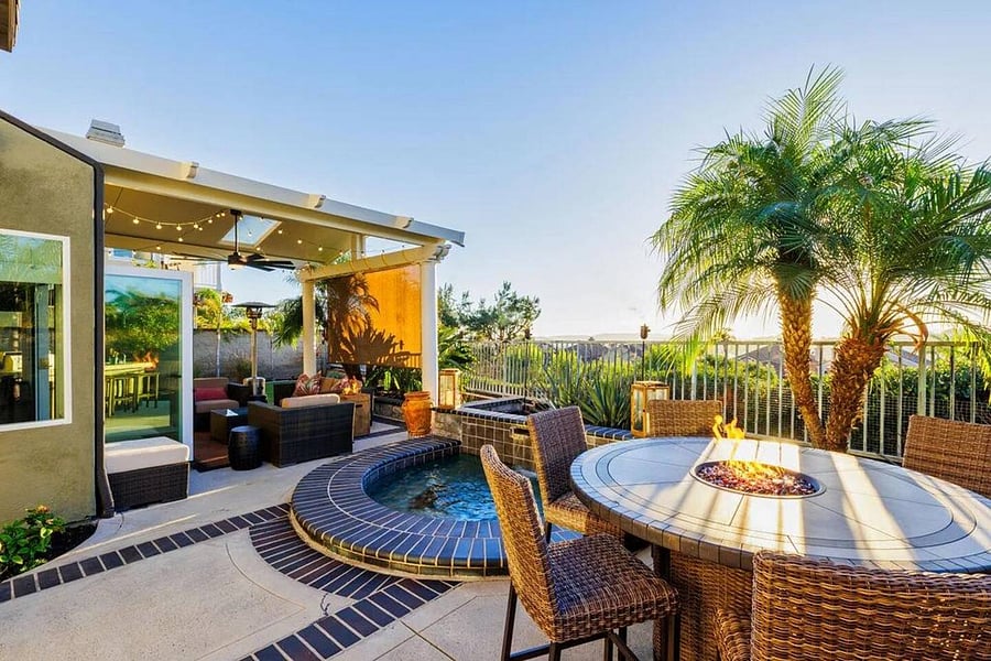 Stunning Resort style backyard with full Barbeque, seating, and fire table.  
Perfect for entertaining,  while overlooking Lake Mission Viejo.
