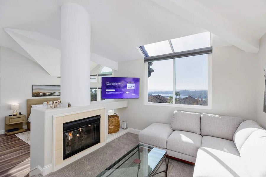 Sit and relax in this quiet, private sitting room area of of master suite with a book, movie or your favorite beverage.  More stunning views