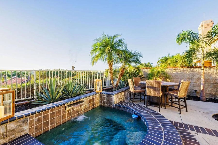 Stunning Resort style backyard with Jacuzzi,  full Barbeque, seating, and fire table.  
Perfect for entertaining,  while overlooking Lake Mission Viejo.