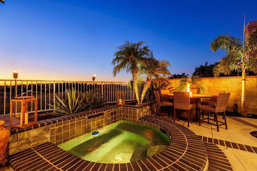 Stunning Resort style backyard with waterfall Jacuzzi full Barbeque, seating, and fire table.  
Perfect for entertaining,  while overlooking Lake Mission Viejo.