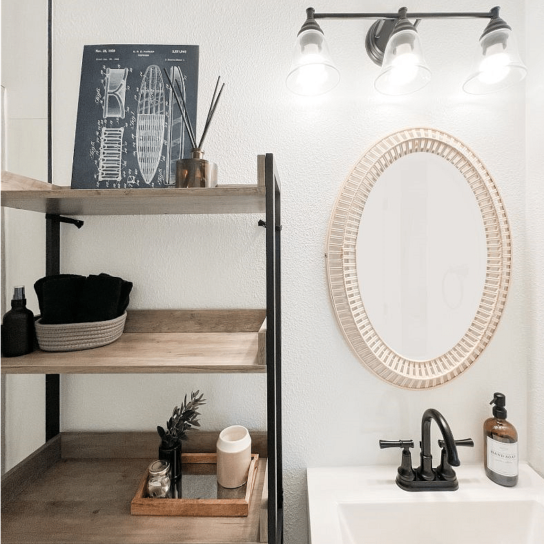 Bathroom w/ shelving storage.