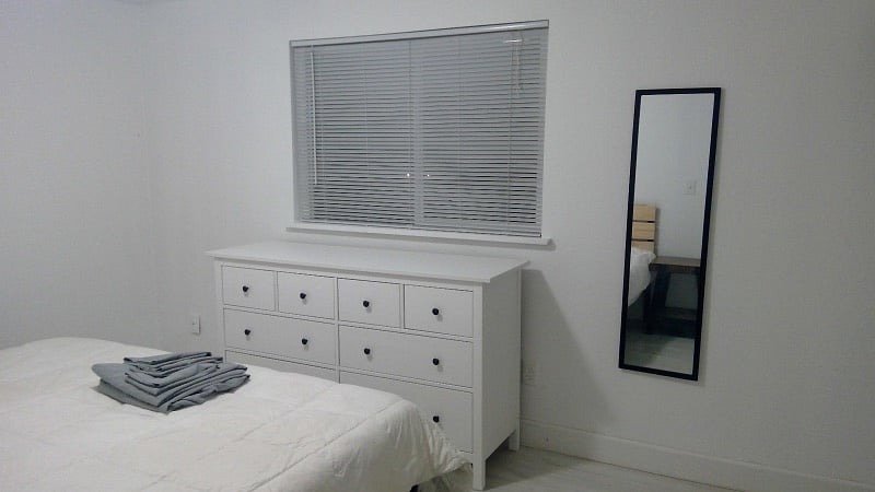 bedroom#3 w/ a king-size bed, two closets (w/ lots of hangers &a laundry basket each), and a double-size dresser.