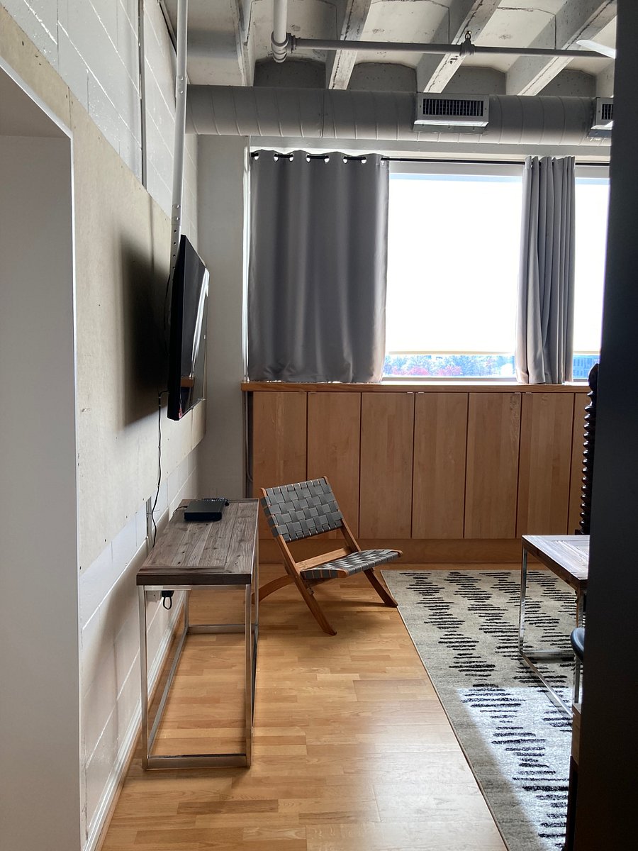 Room darkening curtains. Wall mount TV has a reliable hard wired connection to internet.