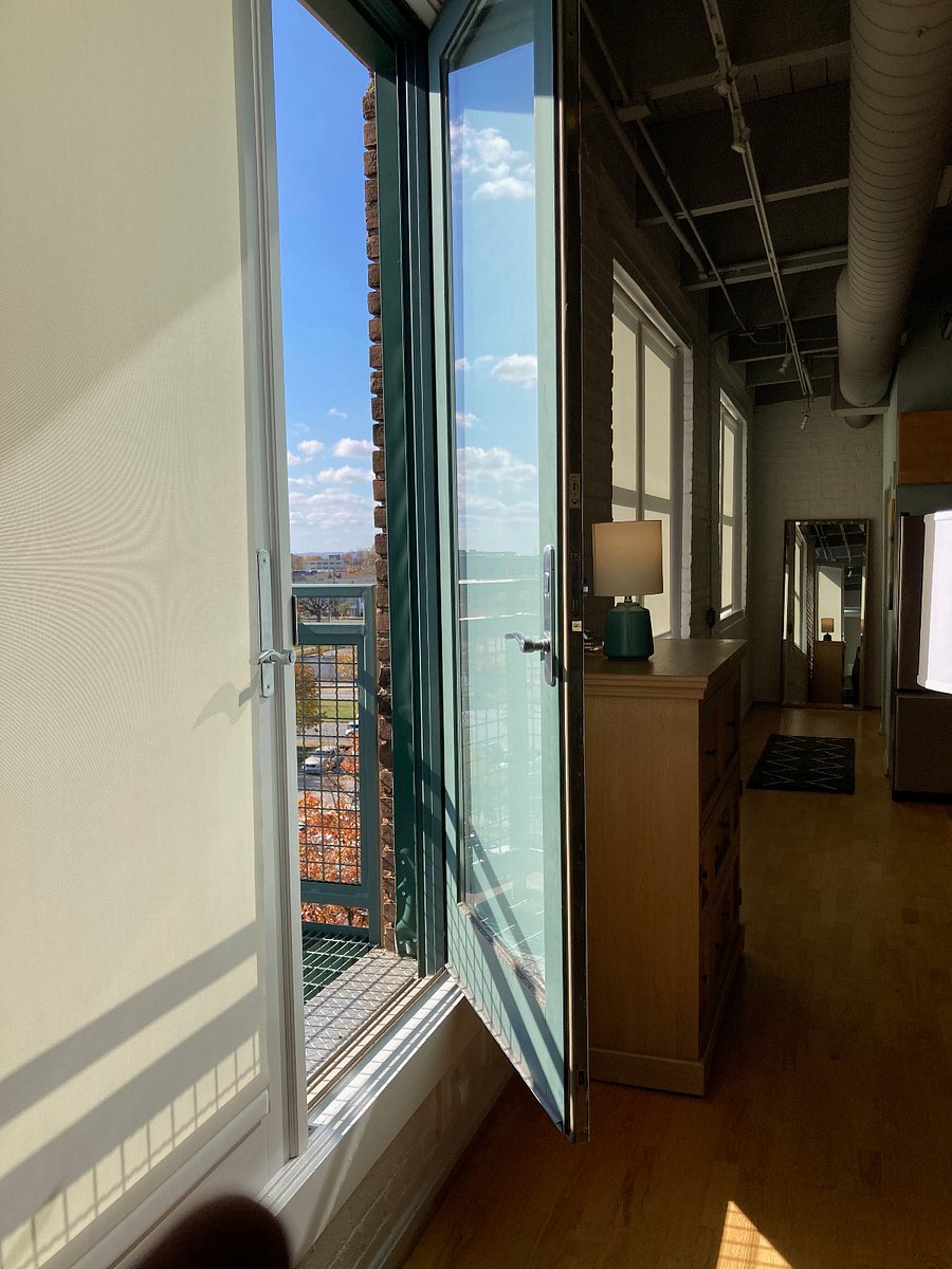 French doors to sunny balcony.