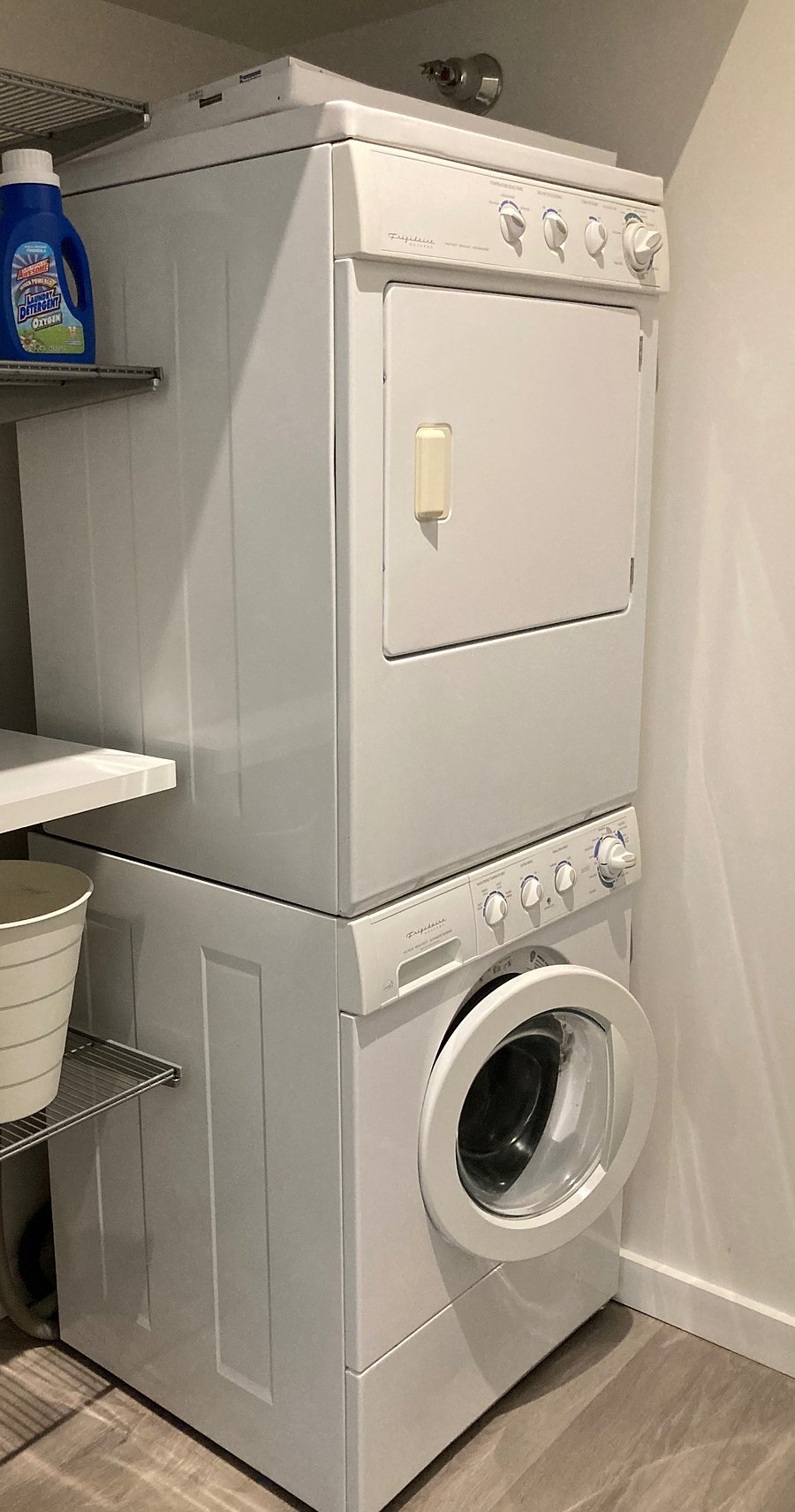 Full size washer and dryer in laundry room.