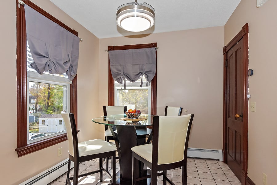 Kitchen table, retractable light/ceiling fan, view of back yard