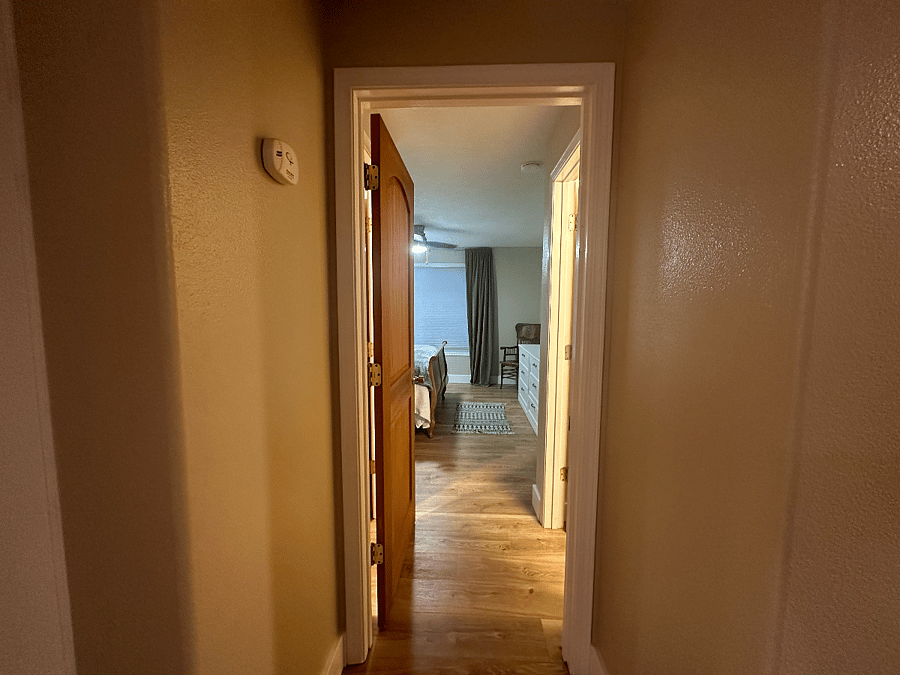Looking into Primary Bedroom from Dine in Kitchen