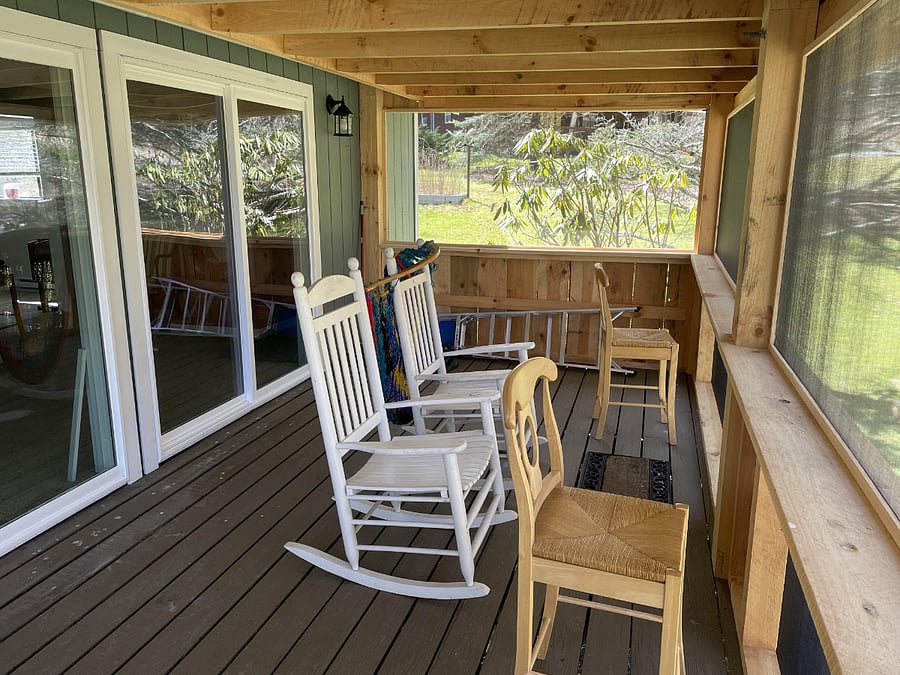 Interior of porch. Newer picture coming showing round dining table and 4 chairs