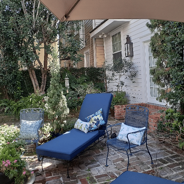Cushioned lounge chairs, fire pit and relaxing gardens.