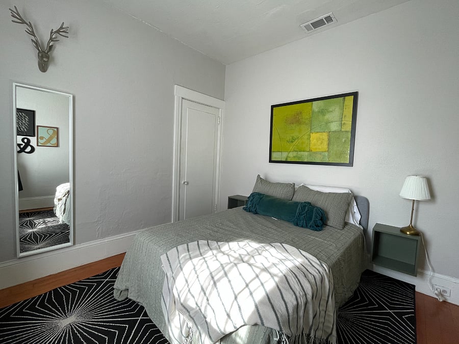 Bedroom includes full length mirror and large closet with plenty of hanging space.