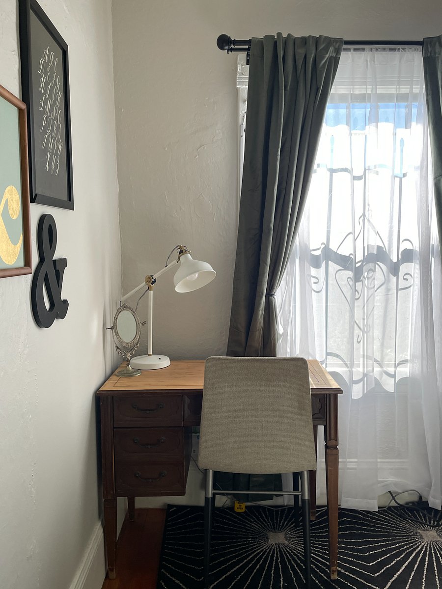 Work space in bedroom looks out over back garden.