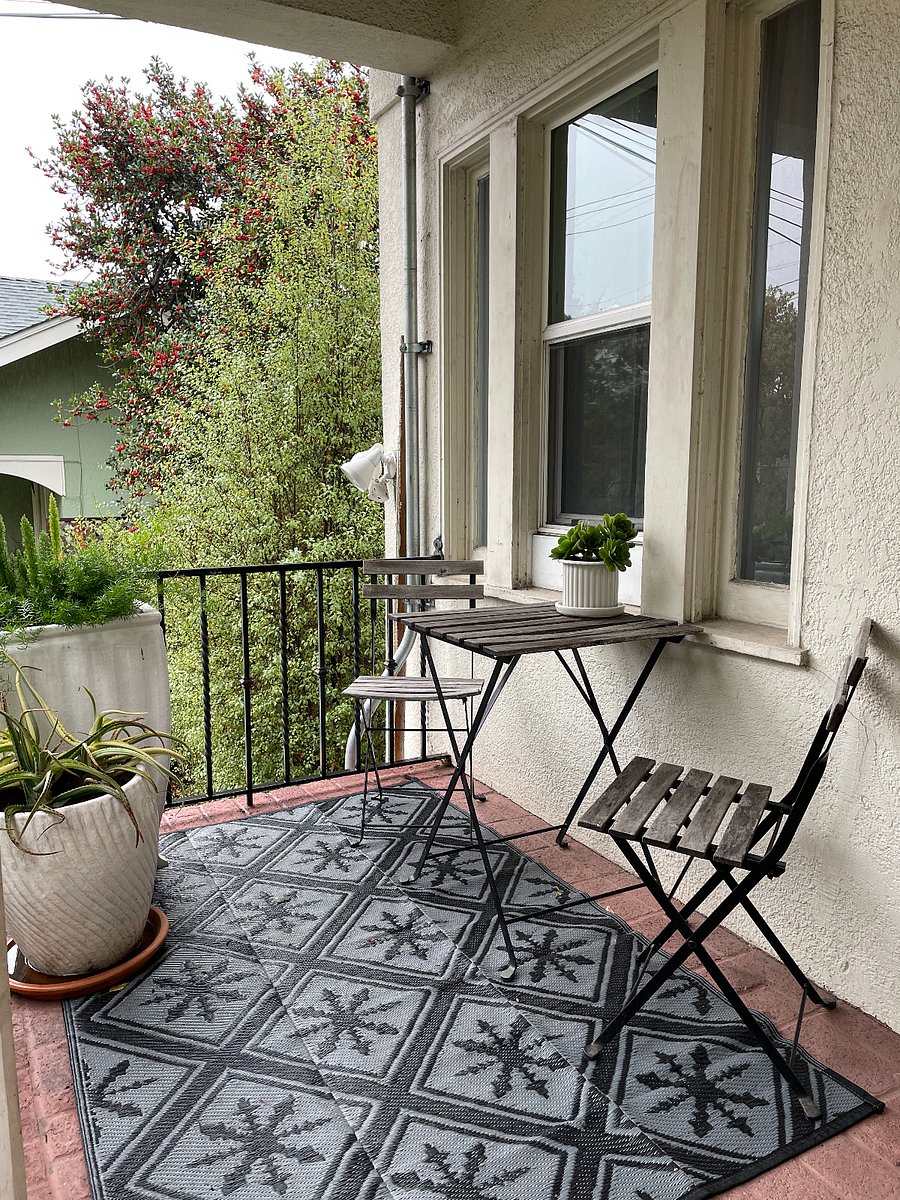 Front porch with table and chairs for morning coffee or private dining al fresco.