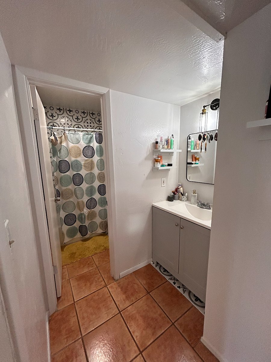 Upstairs bathroom with shared shower