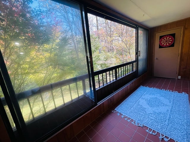 Balcony looking out over wooded trail.