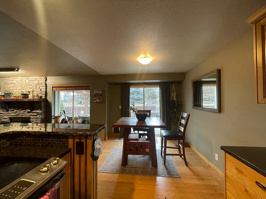 Open floor plan with living, dining, and kitchen