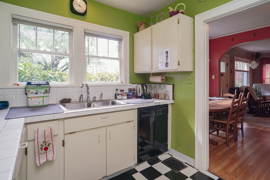 kitchen windows look out to front yard. dishwasher with soap provided.