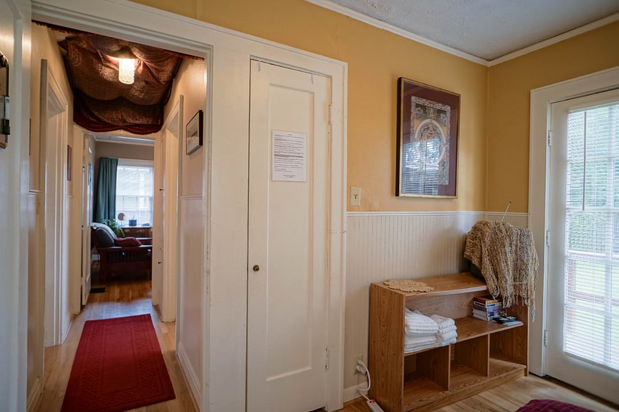 south facing bedroom is sunny and hosts a private entrance to the backyard