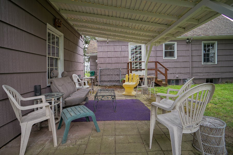 Spacious fenced in backyard with covered patio right outside the private entrance to the south facing bedroom