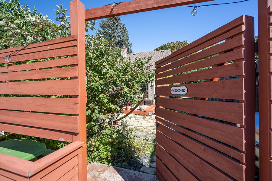 Fenced in backyard with one parking spot for guests in parking slab in back of the house. 