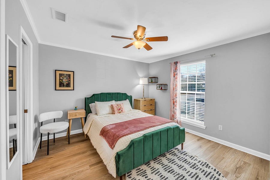Queen Bedroom with Beautifully Bold Green Velvet Frame. Full Closet. 