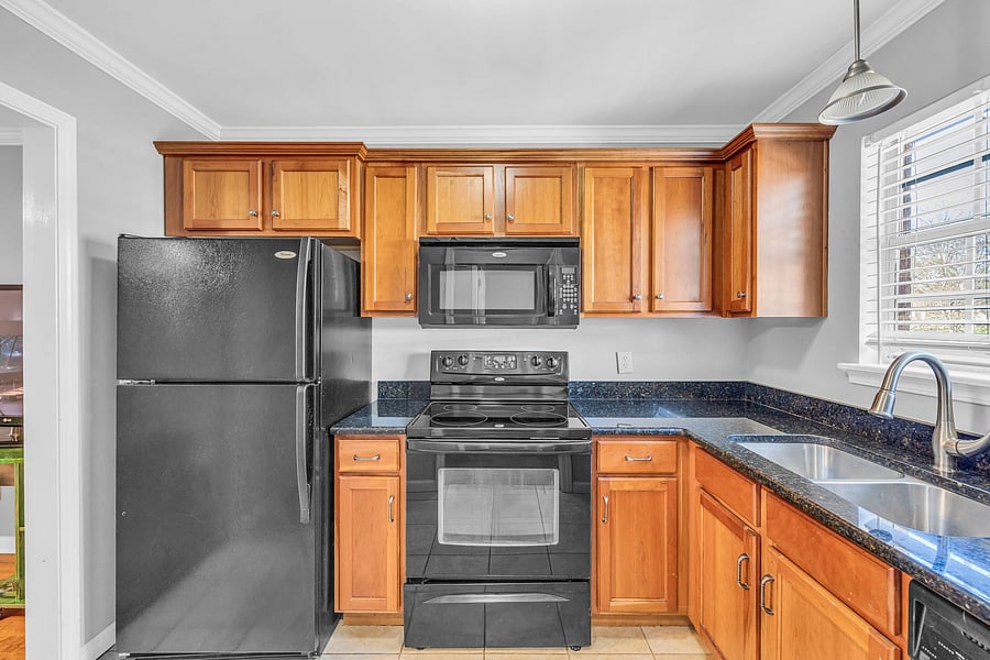 Kitchen area with all appliances, deep double sink.