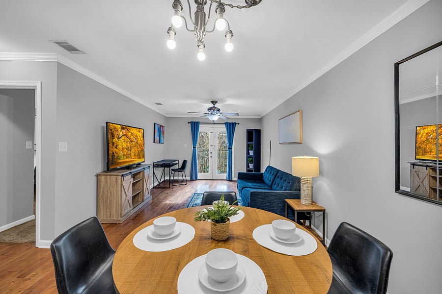 Dining and living room area leading to outside patio.