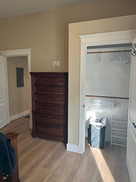 Bedroom has large dresser with ample closet space.