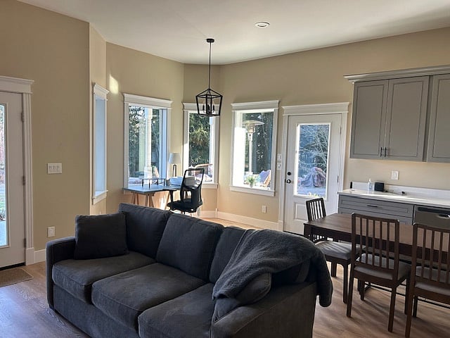 Livingroom looking toward bay window with desk and panoramic view.