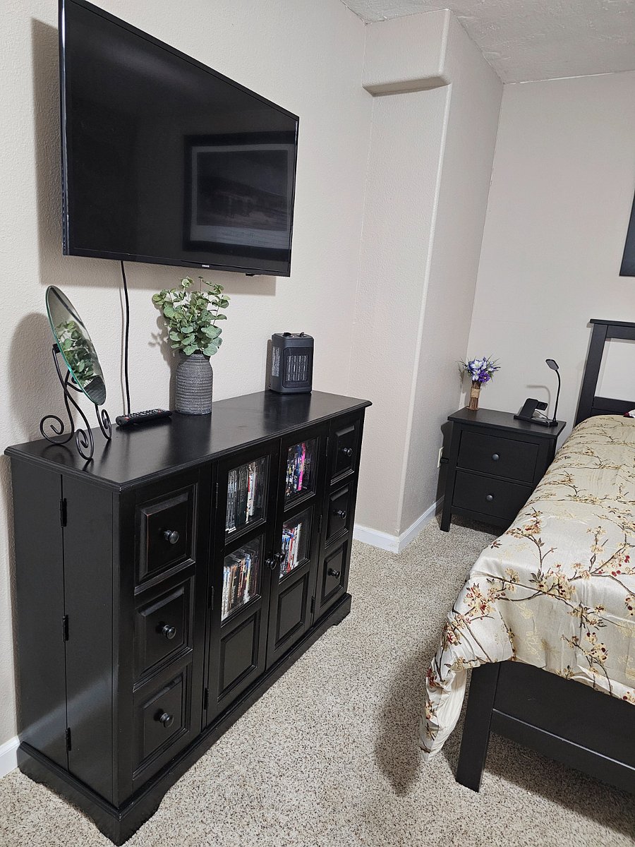 2nd Bedroom, Full size bed, Smart Samsung TV movable mounted and hundreds of DVD's to choose from with many different genres.