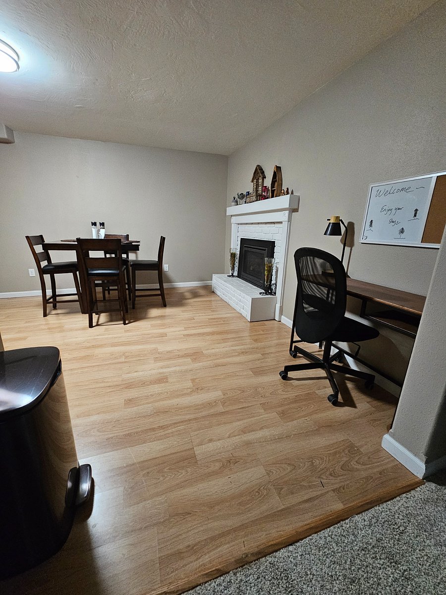 Kitchen entry with computer desk and lamp for office use or pleasure.