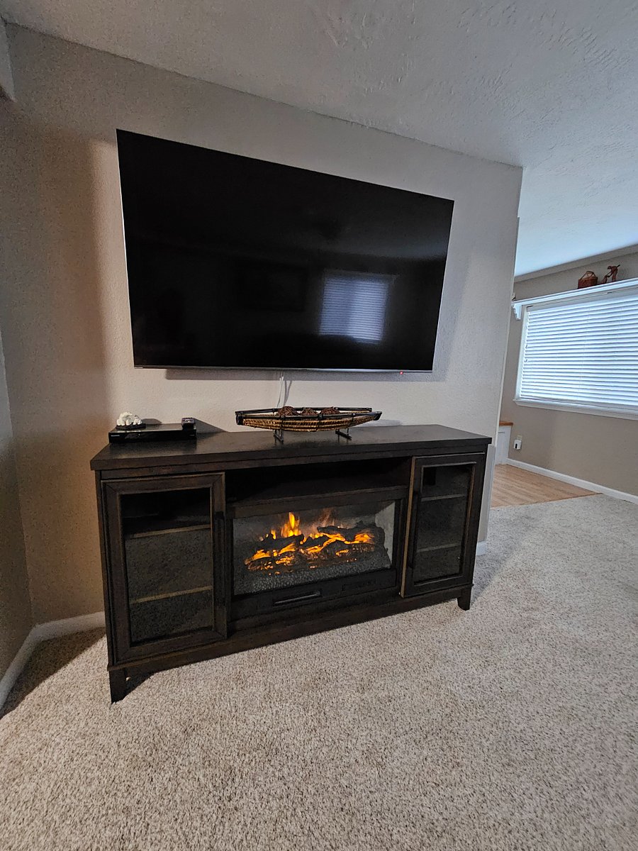 Living room fireplace to keep cozy or just be mesmerized by the flames.