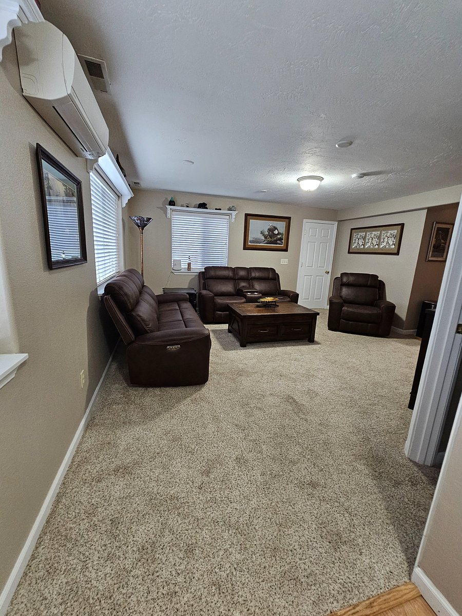 Entry to living room.
New furniture with electric power reclining chair and couches. Amazing Northwest style, look and feel with a Native American accent including famous artwork by renowned Deb Doolittle.