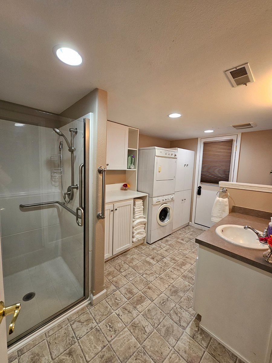 Bathroom and Laundry with stand up shower.