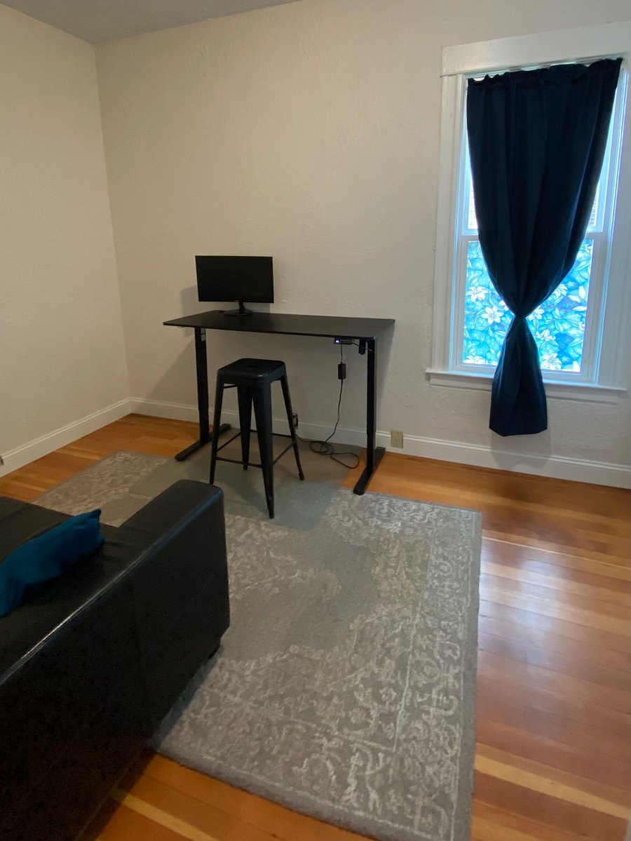 Large office space off dining area, with standing desk