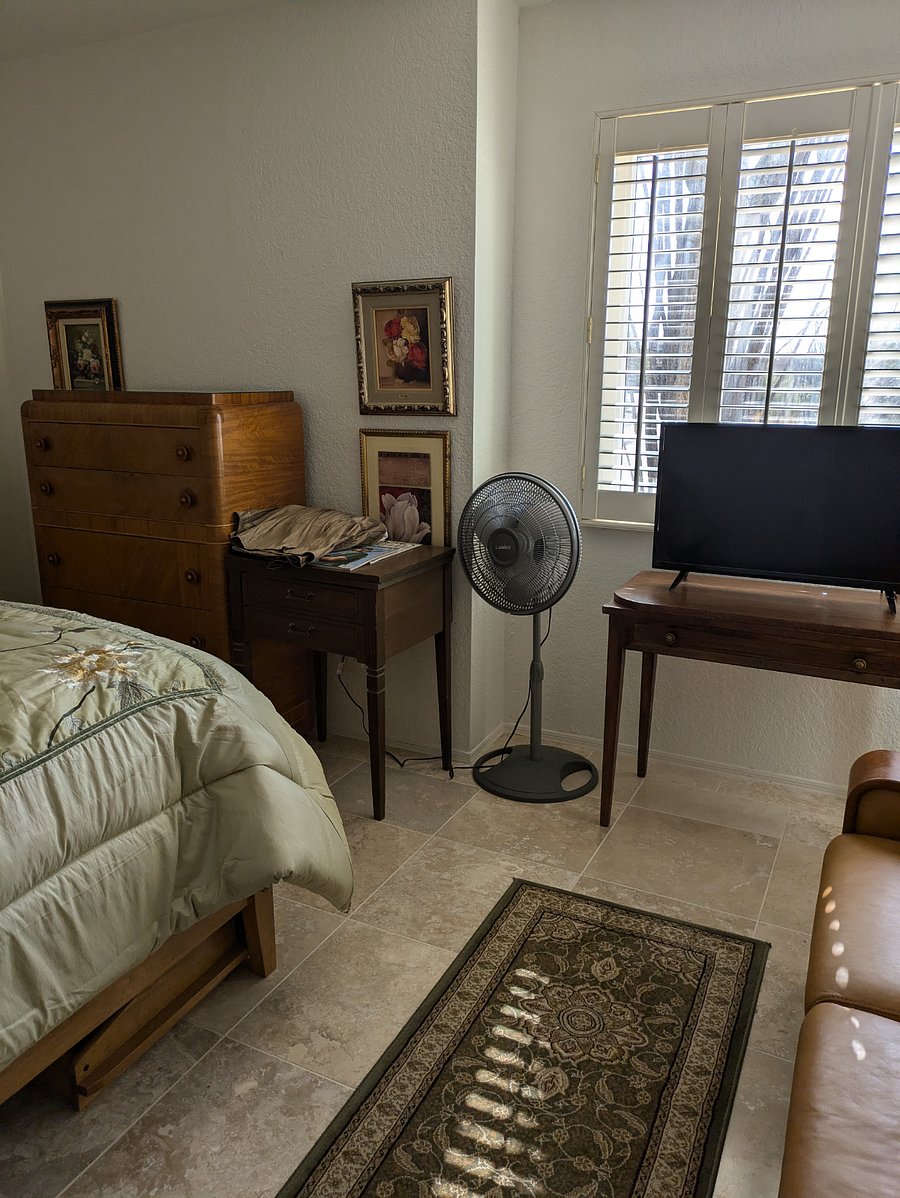 CHEST OF DRAWERS, FAN, FLAT SCREEN TV IN LARGER BEDROOM WHICH IS $1600/MONTH
