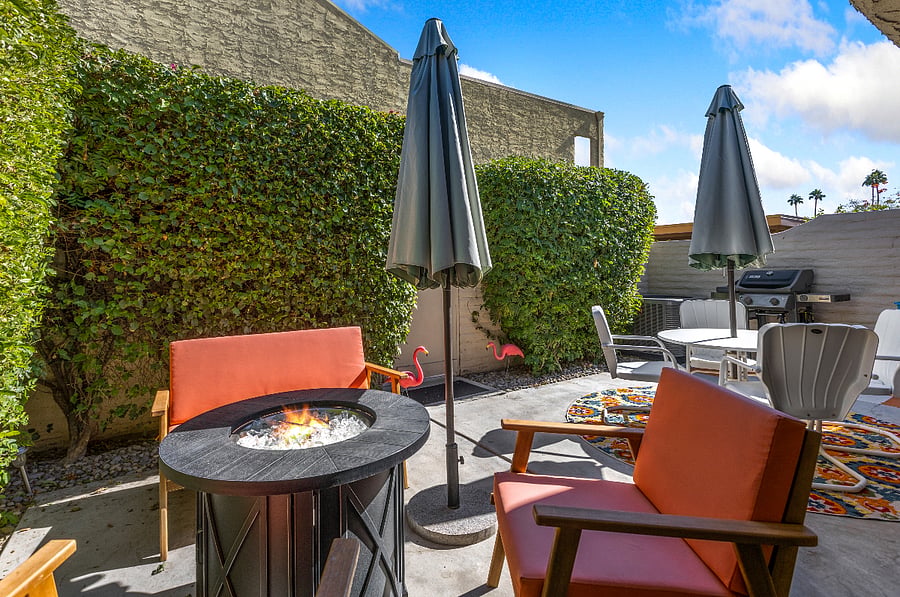 super private back patio with fire pit, seating and propane grill