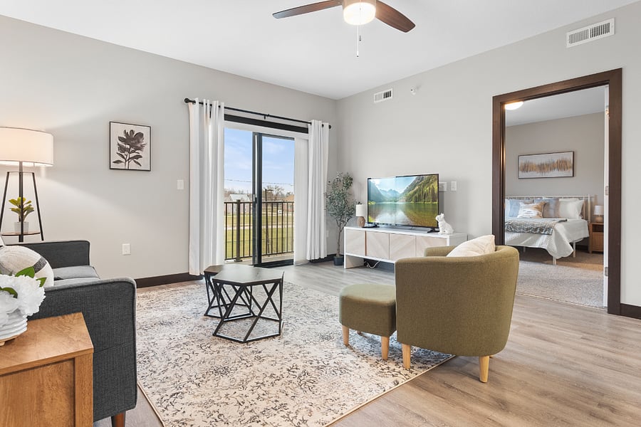 Large living area with smart TV, comfortable couch, and chairs so you can relax after a long day!