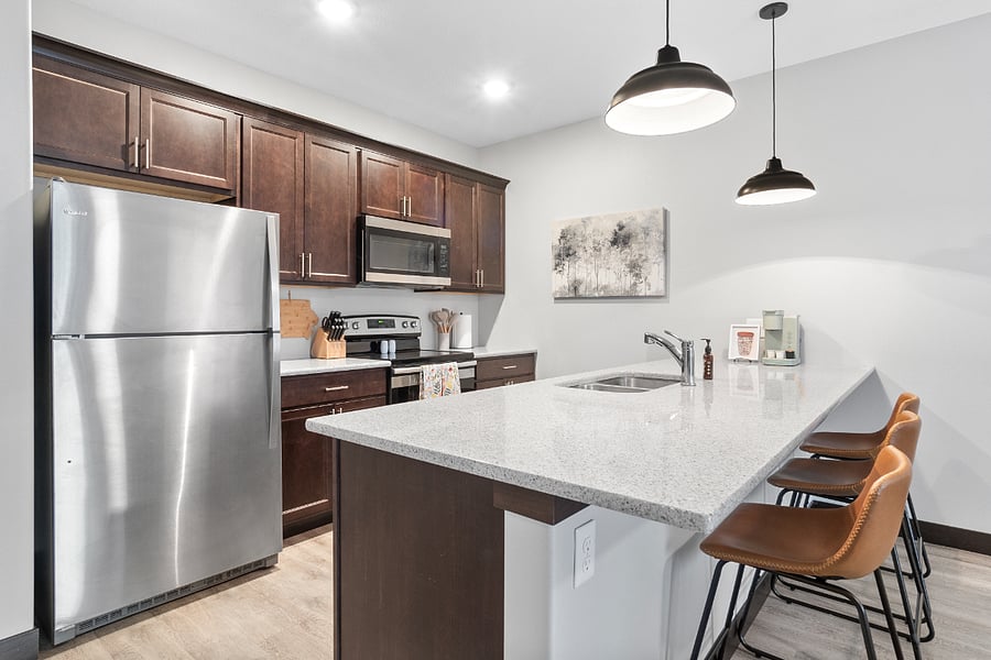 FULL size kitchen - no small appliances here. Great bar to sit at and enjoy your favorite meal!