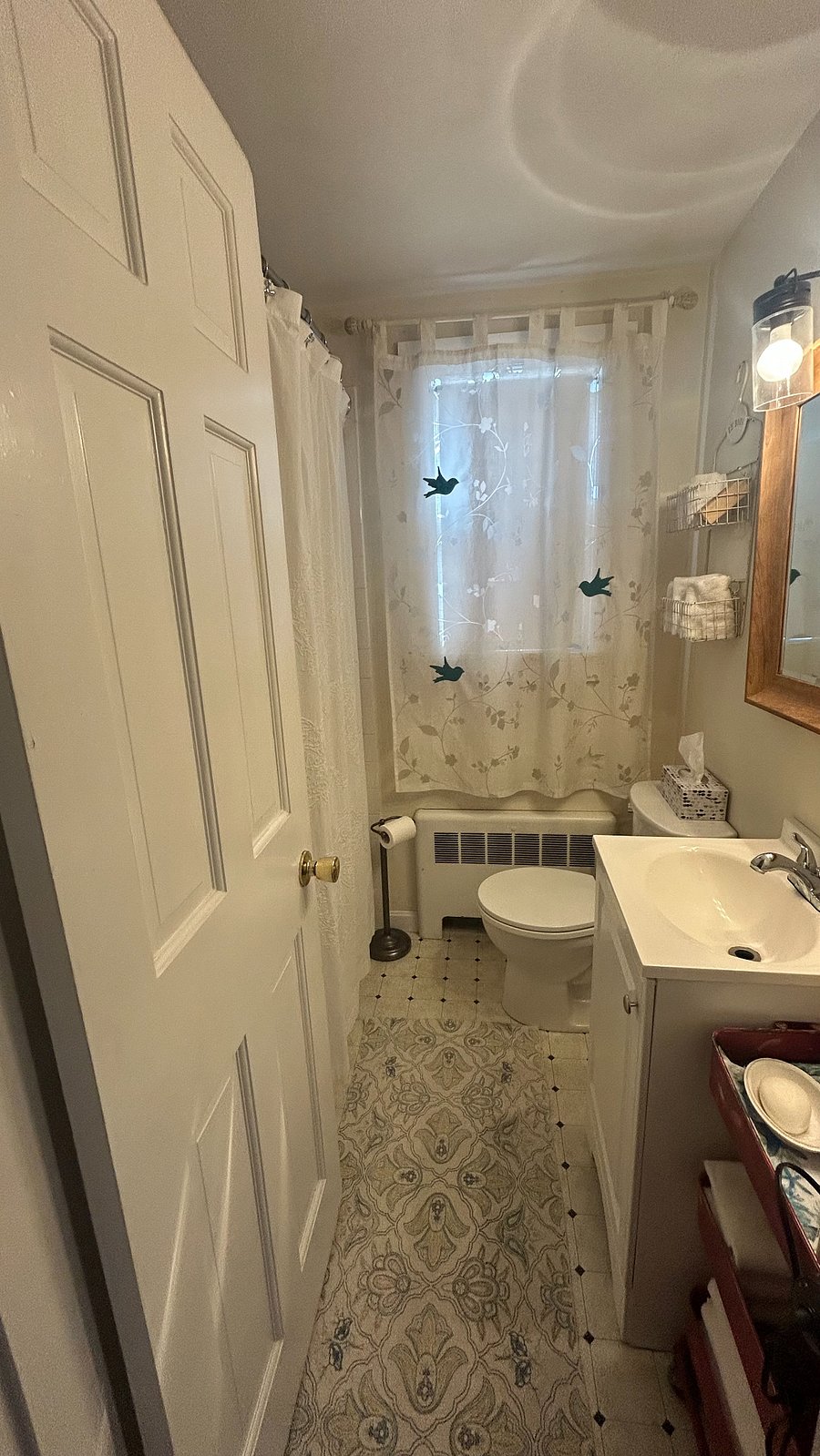 Bathroom with full bath and shower right outside room.