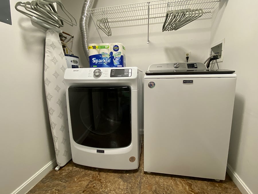 In-unit washer and dryer; starter kit with Tide pods; full-size ironing board and iron