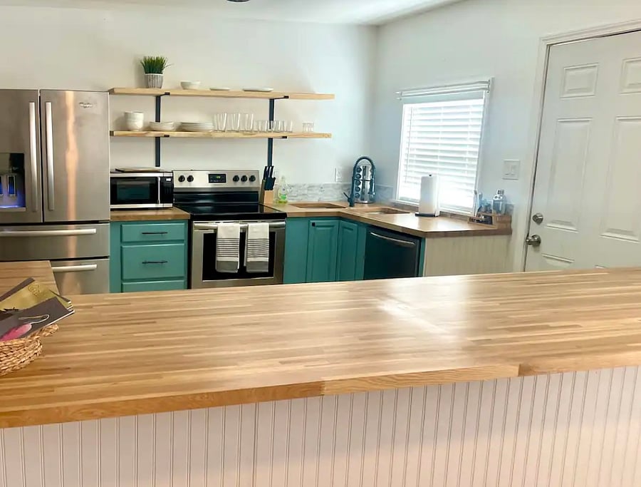 Full kitchen with large fridge