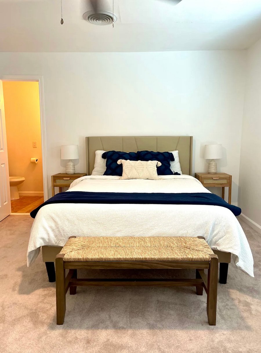 Primary bedroom with queen bed and full bathroom