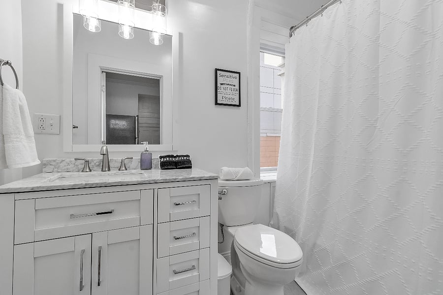 Clean, white and pristine bathroom with tub