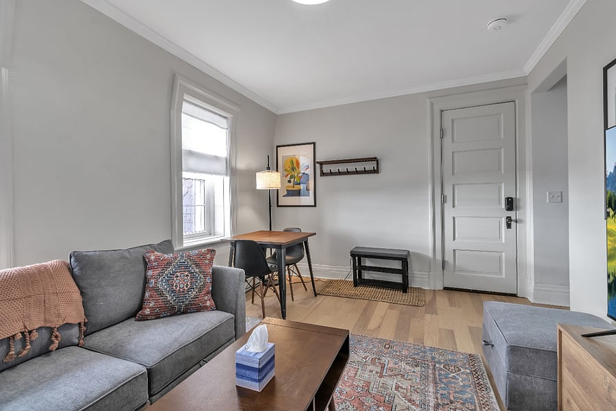Dining table for two, storage for coats and shoes just inside the unit door