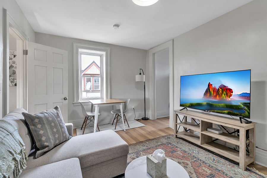 50" Roku TV and dining table with two chairs