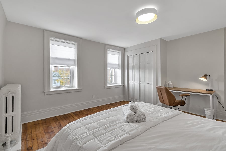 Dedicated workspace in the bedroom next to a large closet