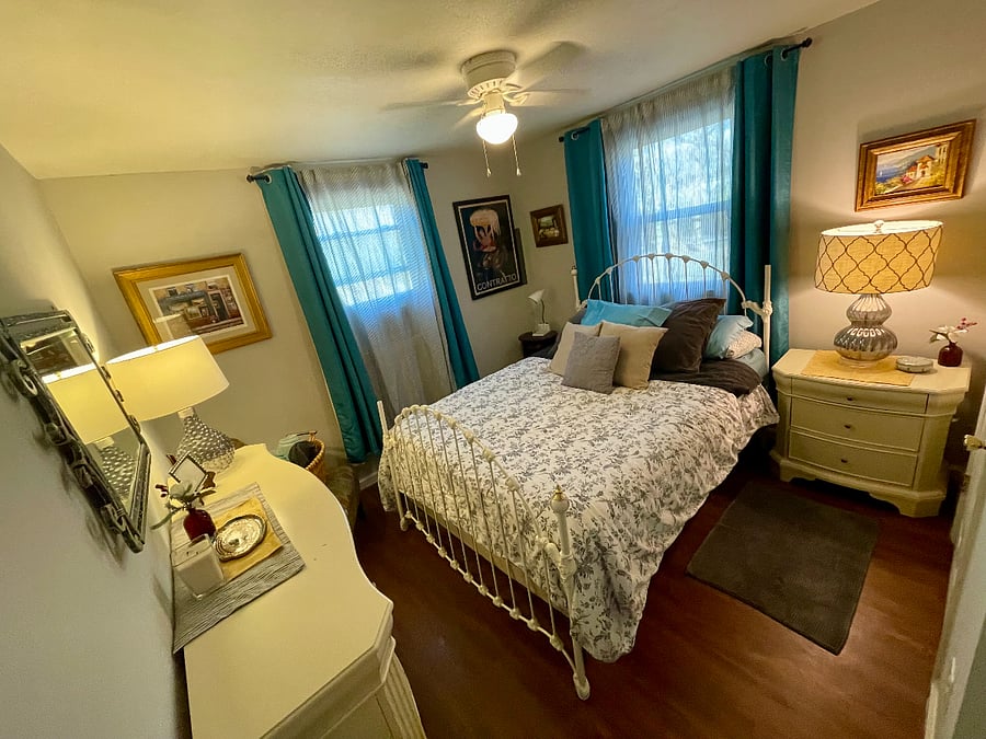 Queen Bed. Room has full closet, lots of drawers for storage and fullsized iron board. Room also has black out curtains to darken the room for naps during bright days.