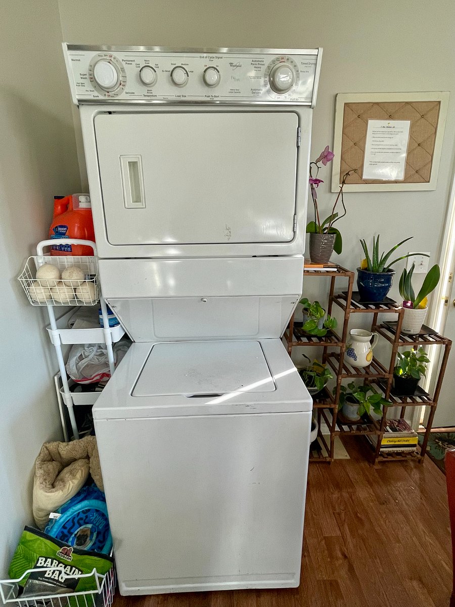 Stacked washer and dryer with supplies. Live plants for your breathing pleasure!